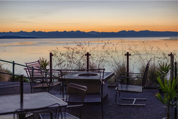 Low tide along the properties coastline, early morning sunrise. mountain range in the background.